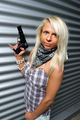 Blonde woman with a plastic gun.jpg